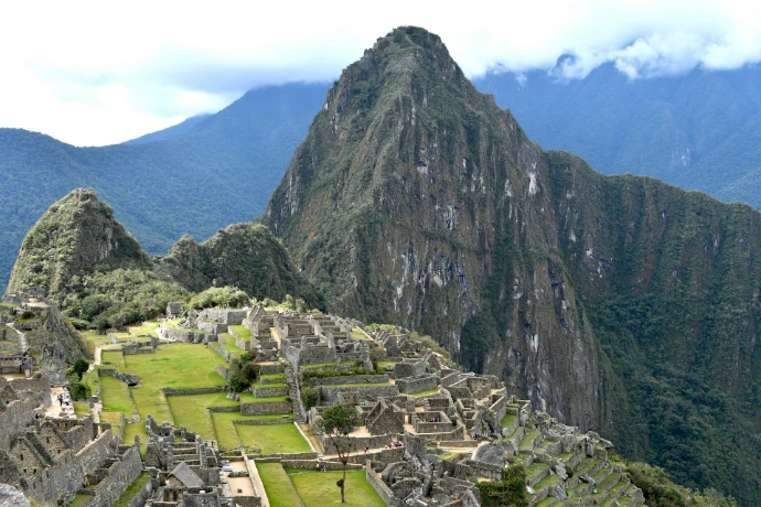 a large mountain with a valley below